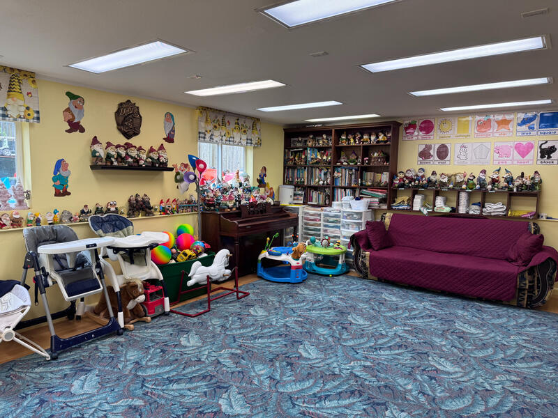 Untitled Cozy daycare room with books, toys, and seating