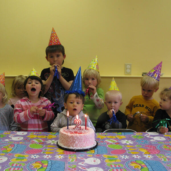 Toddlers celebrating a birthday together