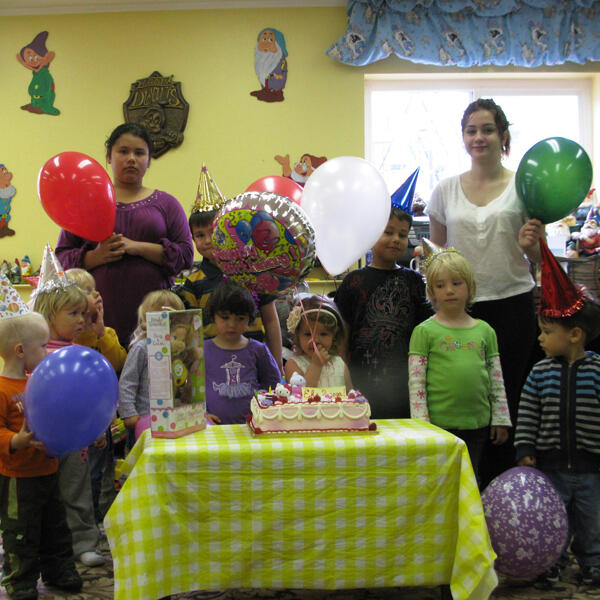 Birthday celebration with balloons and cake at Lana’s Sunset Preschool