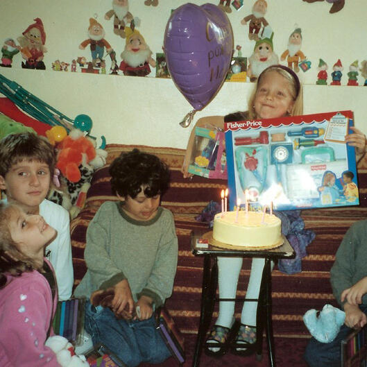 Untitled Birthday celebration with cake, balloon, and gifts