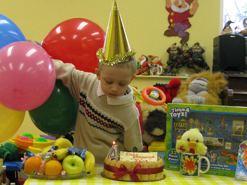 Untitled Twin brothers blowing out birthday candles