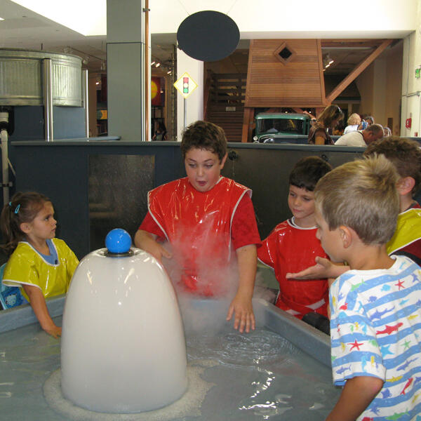 Untitled Children exploring a hands-on science exhibit