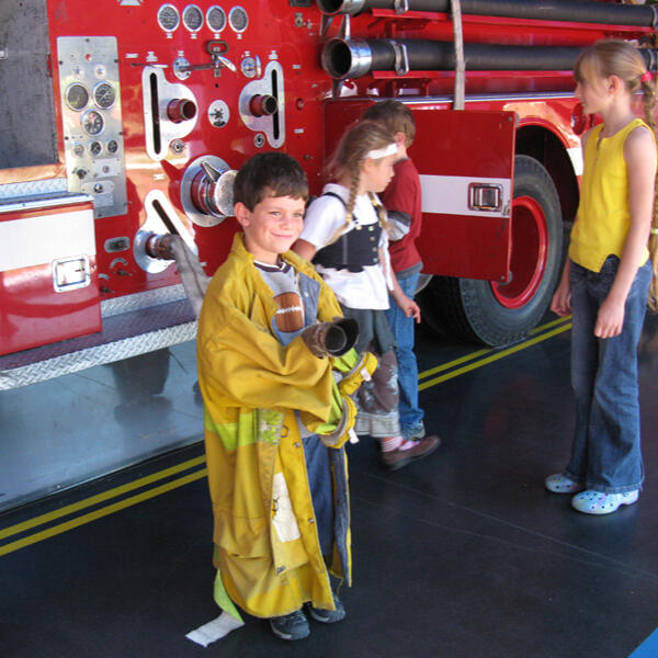 Children visiting a fire truck on a field trip