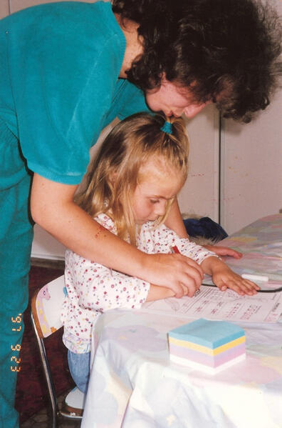 Untitled Child practicing writing at the table