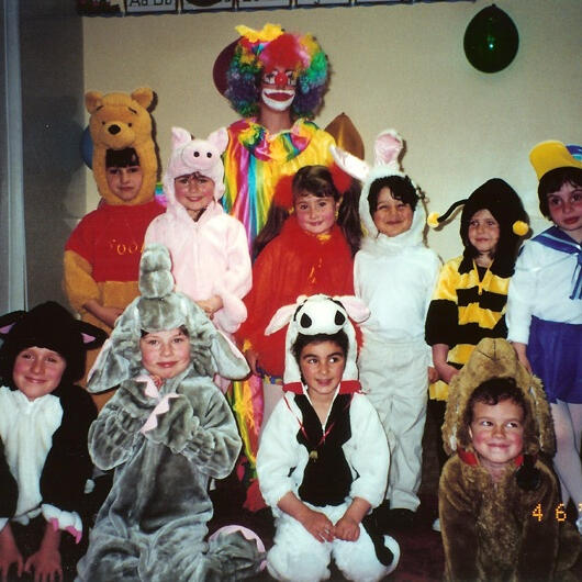 Untitled Children posing in animal and character costumes