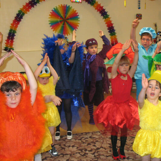 Untitled Children performing in colorful costumes
