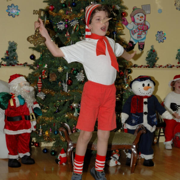 Child performing in a holiday costume