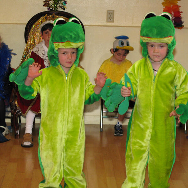 Untitled Children dressed as frogs for a performance