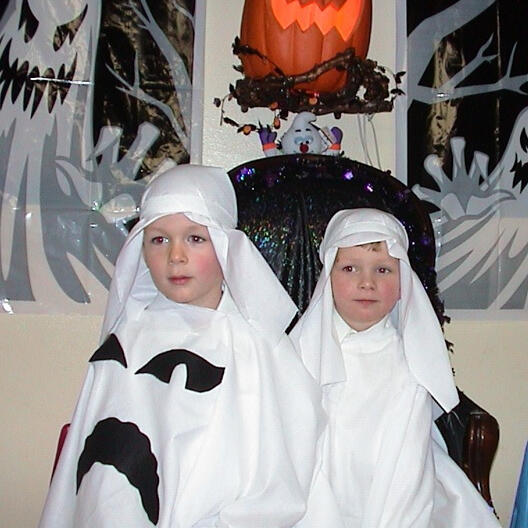 Children dressed as ghosts for a Halloween performance