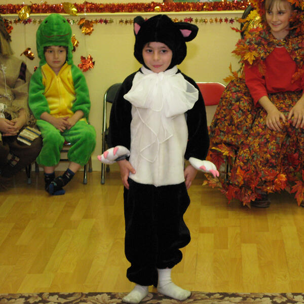 Child performing in a cat costume